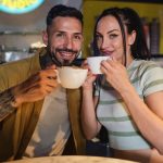 Heterosexual couple looking at camera drinking cof 2023 11 27 05 36 32 utc min