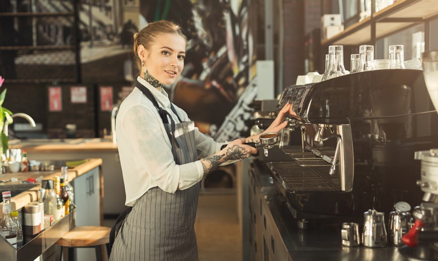 Tattooed barista making coffee in professional cof 2023 11 27 05 02 27 utc min